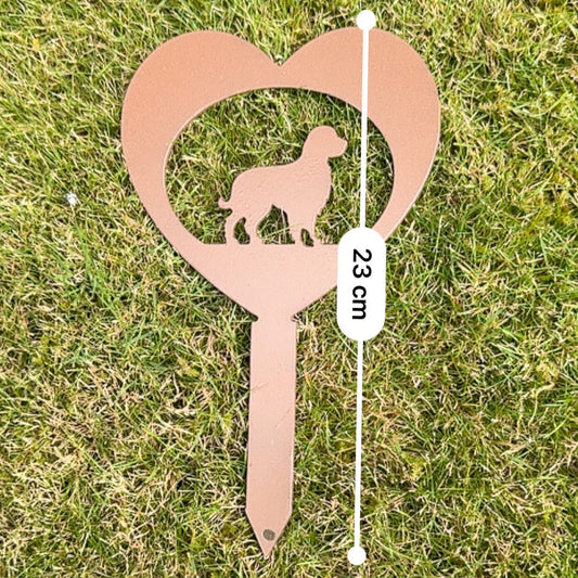Metal garden stake with heart design and dog silhouette on grass